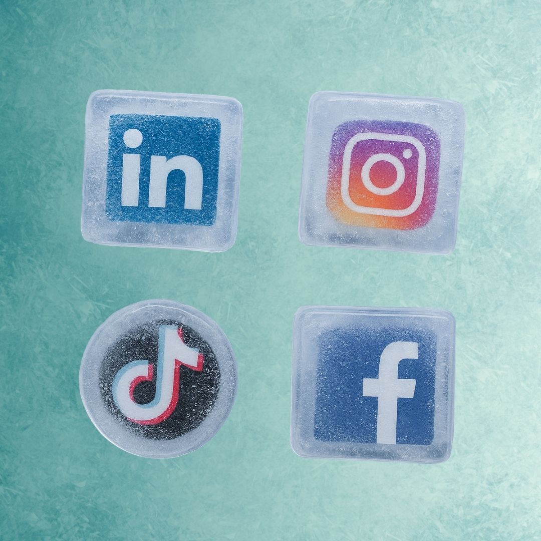 Four social media icons—LinkedIn, Instagram, TikTok, Facebook—appear encased in ice on a textured teal background, conveying a frozen, serene vibe.